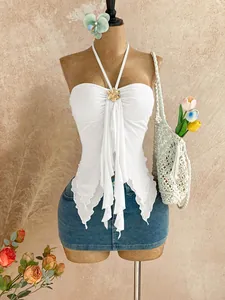 Elegant white mesh halter tube top featuring irregular ruffled hem and gold flower accent