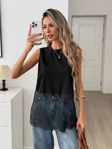 Detailed view of women's black sleeveless tank top with delicate floral lace hem