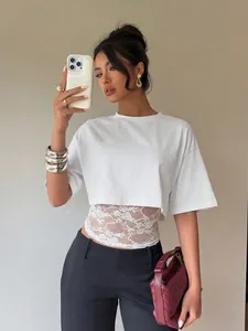 Elegantly designed white cropped T-shirt for women featuring a delicate lace splice and slim fit