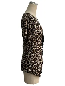 Detailed side view of leopard print blouse with asymmetric neck and butterfly sleeves