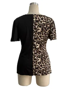 Detailed back view of a women's leopard print and black patchwork top with butterfly sleeves