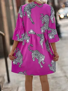 Elegant magenta dress featuring white leopard print and stylish flounce bell sleeves