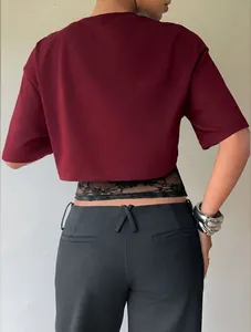 Detailed back view of burgundy crop T-shirt with intricate black lace hem splicing