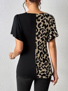 Back view of women's leopard print and black asymmetric patchwork top with butterfly sleeves