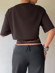 Slim fit chocolate brown cropped T-shirt with elegant lace hem detail shown from the back view
