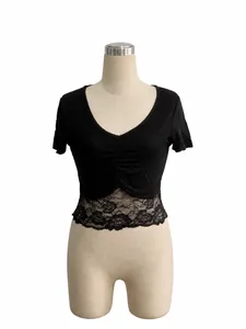 Detail view of a slim fit V-neck crop top with elegant lace patchwork on a mannequin
