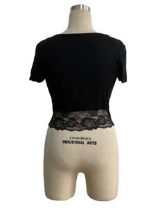 Back view of a black slim-fit crop top with elegant floral lace hem detail