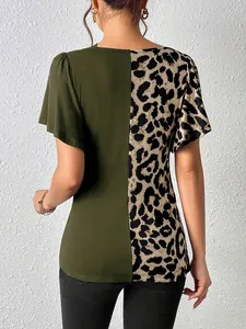 Back view of women's leopard print asymmetric patchwork top with butterfly sleeves