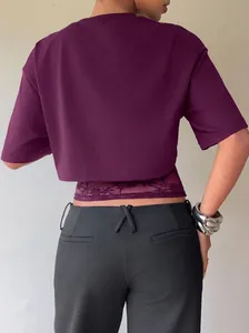 Detail view of a purple 2-in-1 short sleeve t-shirt featuring elegant lace patchwork