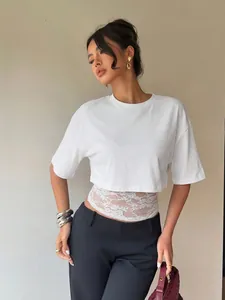 Stylish women's white short sleeve crop T-shirt featuring elegant lace splice detail