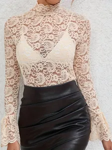 Detail view showing the elegant beige paisley lace texture and flared bell sleeves on a slim-fit top