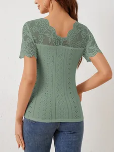 Close-up view of the back detail on a green lace patchwork slim fit short sleeve top