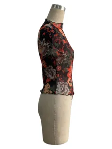 Detailed side view of floral print mesh T-shirt featuring delicate lettuce edge trim.
