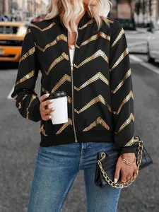 Chic black women's bomber jacket with metallic gold zigzag print on urban street model
