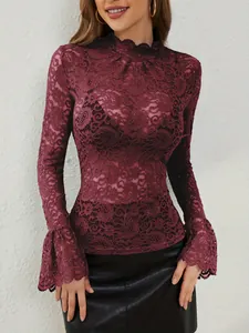 Detail view of burgundy paisley lace fabric and elegant flared bell sleeves