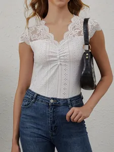 Elegant white slim-fit V-neck T-shirt featuring intricate lace patchwork and button detail