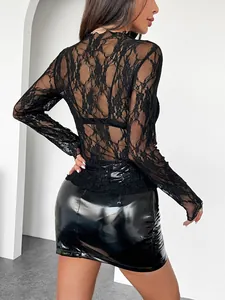 Back view of a chic black floral lace long-sleeve top for women, featuring a slim fit.