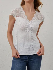 Elegant white lace patchwork V-neck top with buttons and embroidery detail for women