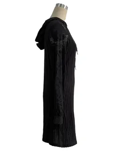 Close-up side view of a black casual hooded dress featuring elegant lace raglan sleeves