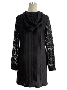 Detail view of the back of a black hooded dress with lace sleeves and rib knit texture