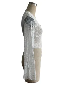 Side view of white sheer lace top with elegant flared long sleeves and a V-neck design