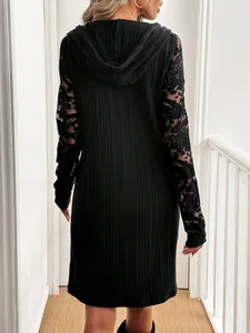 Elegant black hooded casual dress featuring lace patchwork sleeves, back view angle