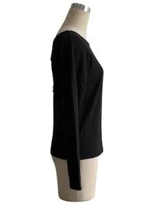 Side view of black ribbed long-sleeve T-shirt showing detailed fabric texture and fit.
