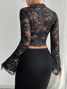 Detailed back view of a black sheer lace top with elegant flared bell sleeves