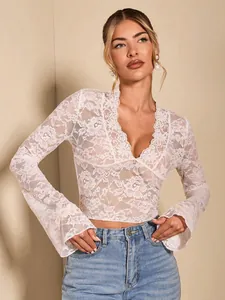 Elegant women's white floral lace V-neck top with stylish flared long sleeves, fall fashion.