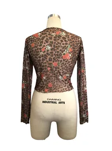 Detailed back view of women's leopard and floral print mesh long sleeve crop top