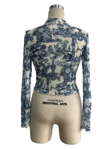 Back view of sheer blue floral print long sleeve mesh crop top on mannequin