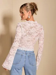 Elegant white sheer floral lace top with long flare sleeves for a sophisticated look.