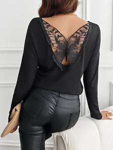 Detail of black ribbed long sleeve top featuring intricate butterfly lace back design