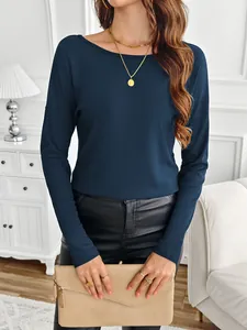 Close-up detail of women's navy blue ribbed long sleeve T-shirt styled with jewelry