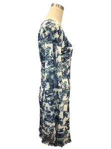 Detailed view of the blue toile de jouy print and flared mesh sleeves on a dress