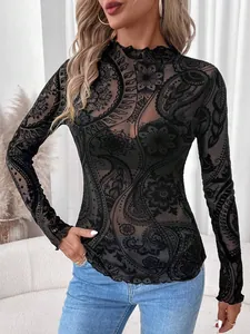 Detailed view of women's black paisley flocked mesh top with mock neck and lettuce trim
