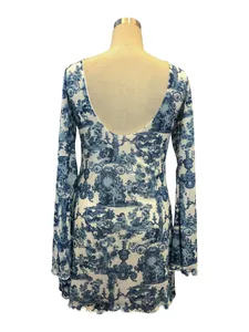 Detailed back view of a blue and white toile printed mesh dress with elegant flared sleeves.