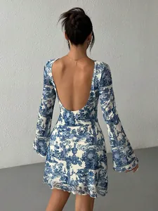 Elegant women's blue printed mesh dress featuring flare sleeves and a deep open back design