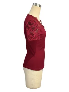 Elegant burgundy short sleeve top featuring detailed floral lace sleeve panels side view