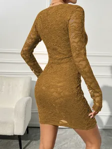 Detailed back view of a mustard yellow slim-fit lace long sleeve party dress