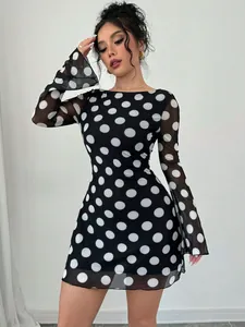 Elegant sexy black and white polka dot mesh mini dress featuring stylish flare sleeves