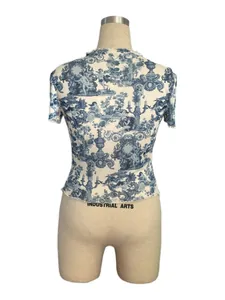 Detail of vintage blue toile mesh t-shirt featuring elegant ruffle lettuce hem