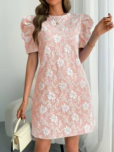 Close-up detail of vintage pink puff sleeve dress with white floral jacquard texture