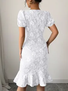 Back view of white floral jacquard midi dress with puff sleeves and ruffle hem