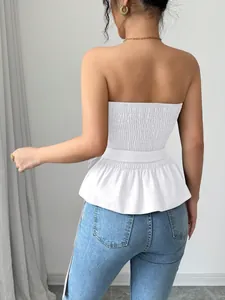 Back view of white French style smocked tube top with peplum hem