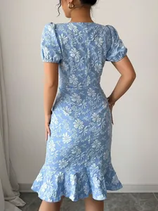 Detailed back view of light blue floral textured bodycon midi dress with ruffled hem