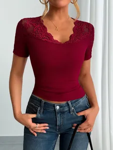 Elegant burgundy short sleeve top featuring V-neck lace trim and ribbed texture details.