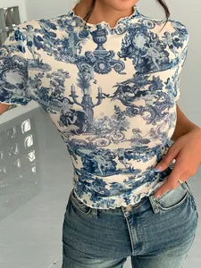 Detailed view of women's mesh top with blue vintage print and lettuce edge trim