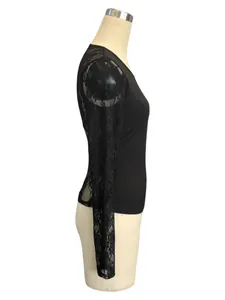Side view detail of a black slim-fit top with delicate lace patchwork long sleeves