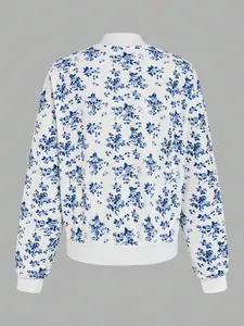 Elegant women's white bomber jacket featuring blue vintage floral prints and ribbed trims